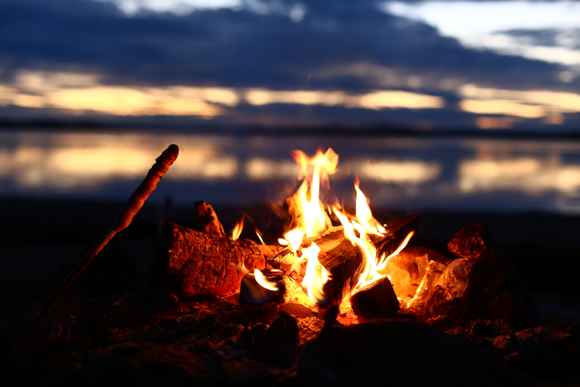 Campfire by the lake at dusk